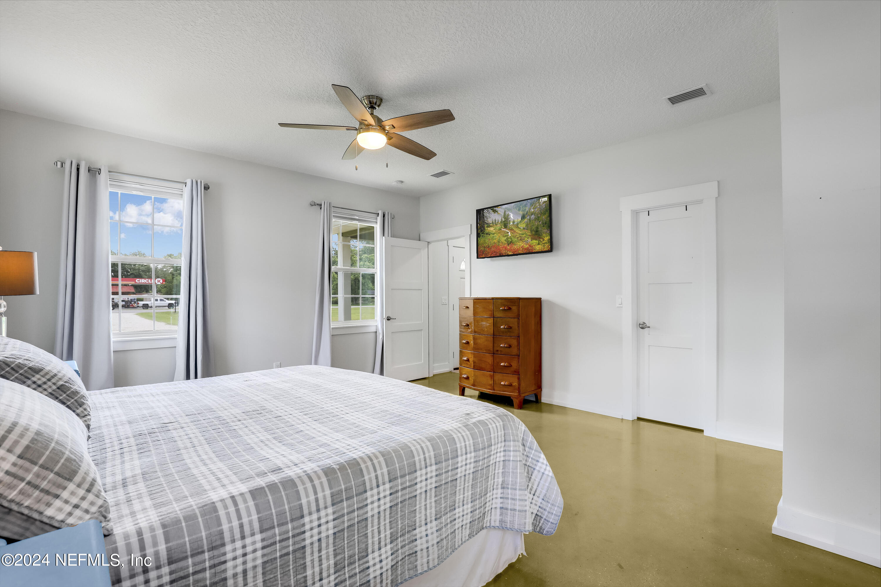 540685 Lem Turner Road Callahan, FL 32011 - Photo 21 of 58 a bedroom with a bed and a window