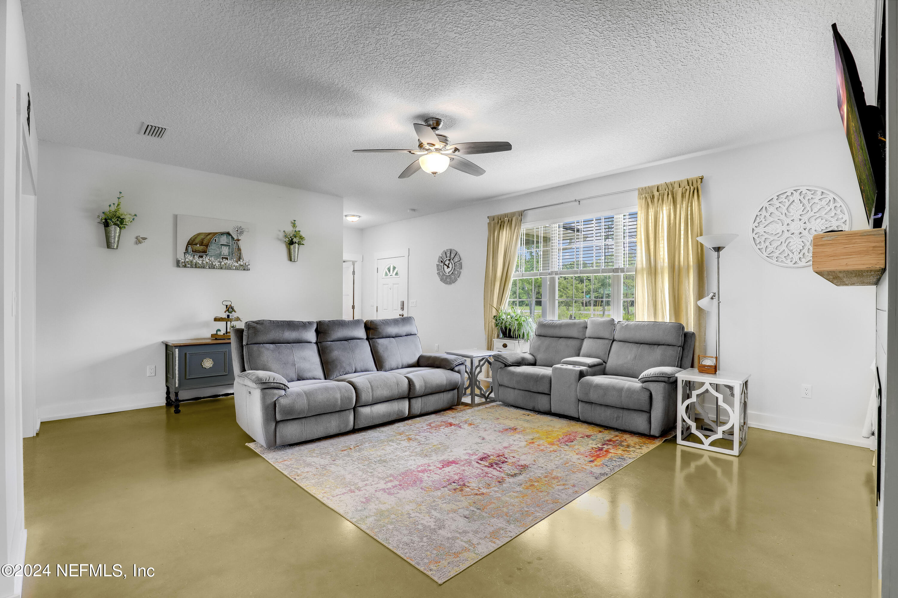 540685 Lem Turner Road Callahan, FL 32011 - Photo 3 of 58 a living room with furniture and a window