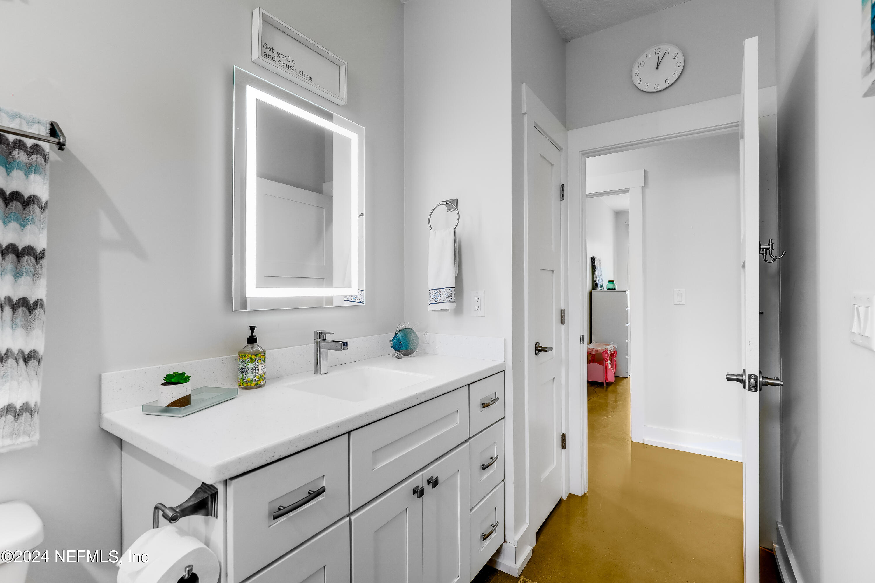 540685 Lem Turner Road Callahan, FL 32011 - Photo 31 of 58 a bathroom with a sink a vanity and a mirror