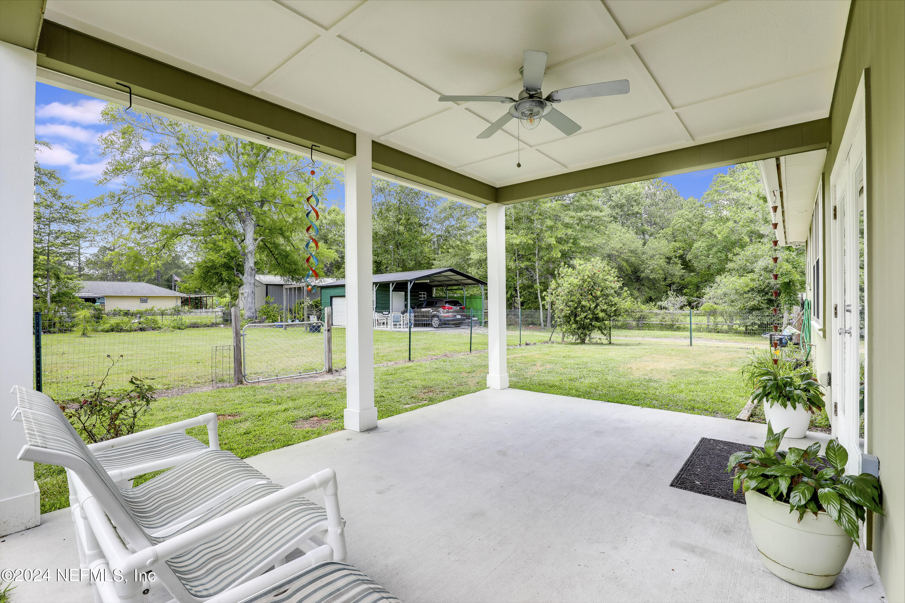540685 Lem Turner Road Callahan, FL 32011 - Photo 35 of 58 a view of a porch and garden