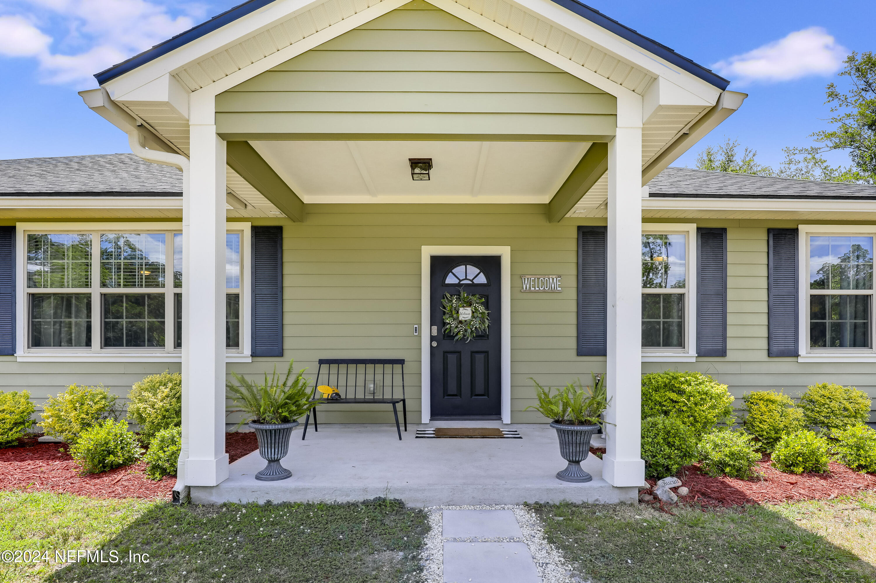 540685 Lem Turner Road Callahan, FL 32011 - Photo 8 of 58 a front view of a house with a yard
