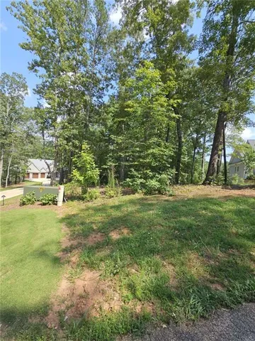 a view of outdoor space with trees all around