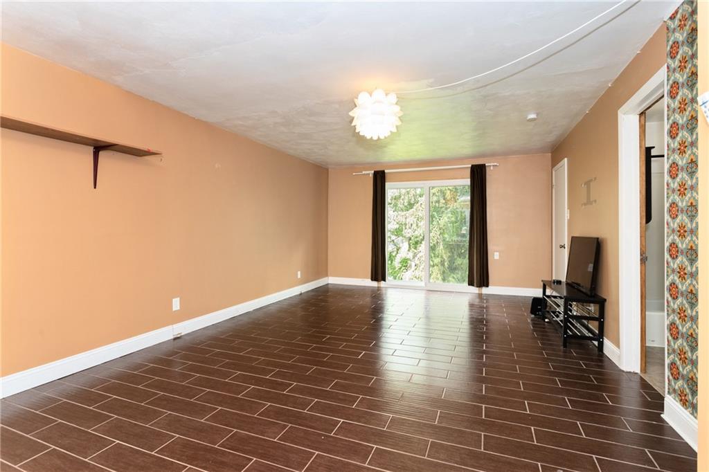 9 Woodside Road Pittsburgh, PA 15221 - Photo 13 of 24 a view of an empty room with a window