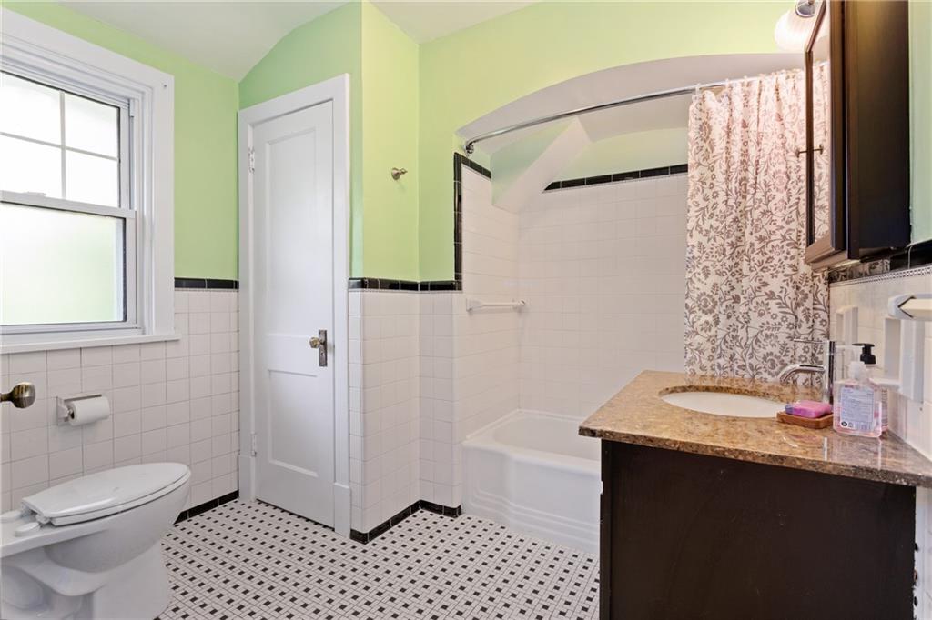 9 Woodside Road Pittsburgh, PA 15221 - Photo 15 of 24 a bathroom with a sink a toilet and shower