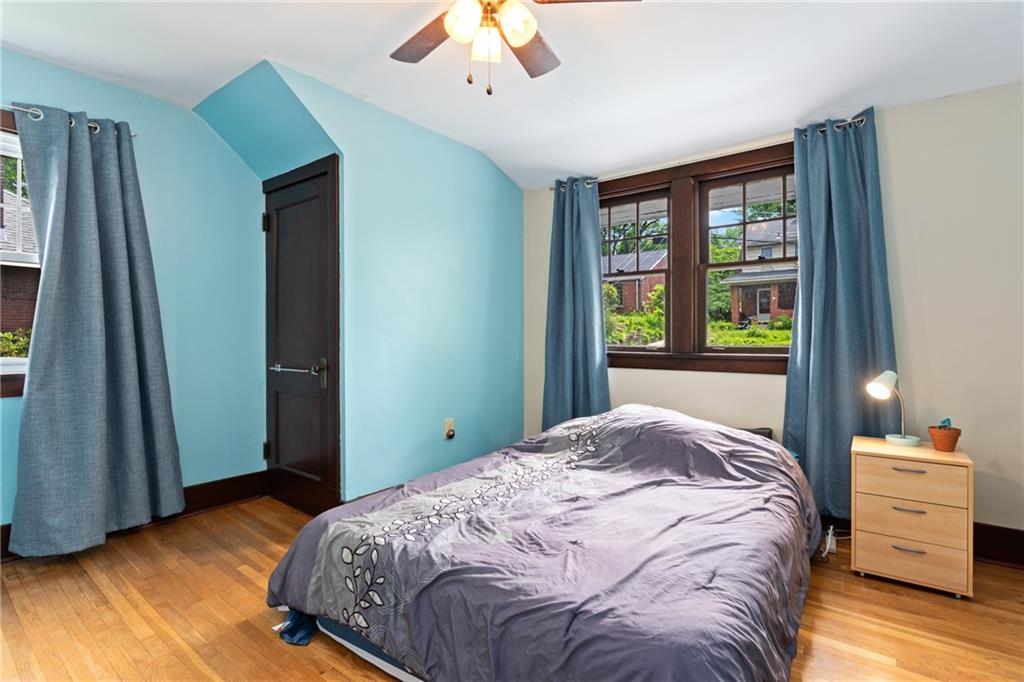 9 Woodside Road Pittsburgh, PA 15221 - Photo 16 of 24 a bedroom with a bed and a window