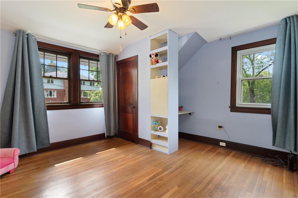 9 Woodside Road Pittsburgh, PA 15221 - Photo 18 of 24 a view of an empty room with window and wooden floor