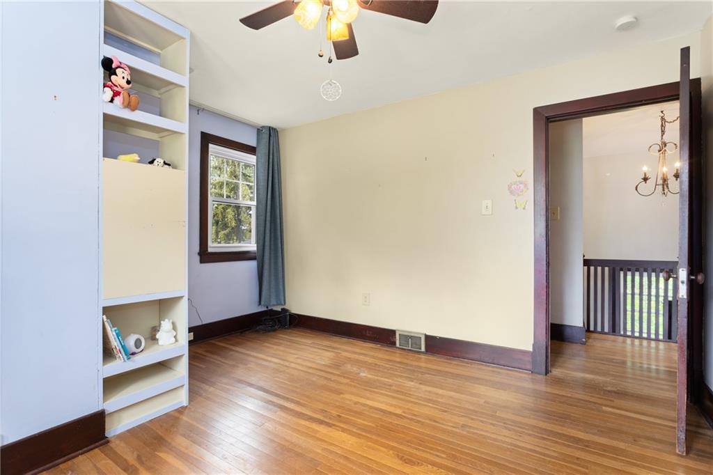 9 Woodside Road Pittsburgh, PA 15221 - Photo 19 of 24 wooden floor in an empty room with a window
