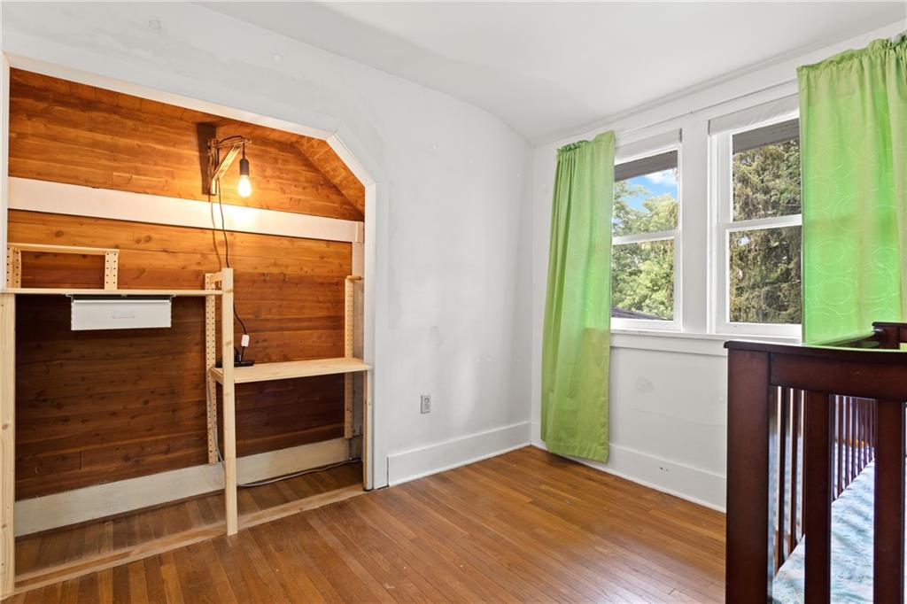 9 Woodside Road Pittsburgh, PA 15221 - Photo 20 of 24 a view of an empty room with wooden floor and a window