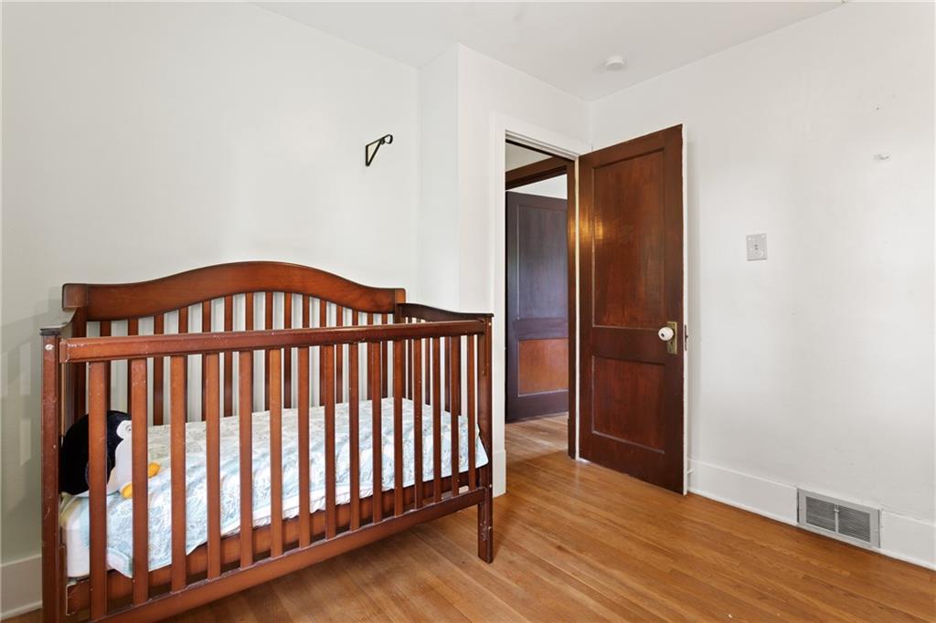 9 Woodside Road Pittsburgh, PA 15221 - Photo 21 of 24 a view of a hallway with wooden floor