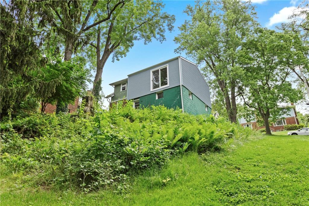 9 Woodside Road Pittsburgh, PA 15221 - Photo 23 of 24 a front view of a house with garden