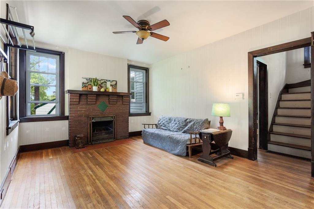 9 Woodside Road Pittsburgh, PA 15221 - Photo 3 of 24 a living room with furniture and a fireplace