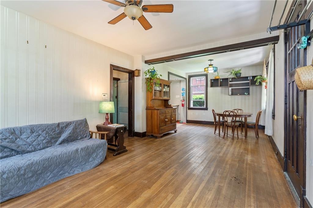 9 Woodside Road Pittsburgh, PA 15221 - Photo 4 of 24 a living room with furniture and a wooden floor