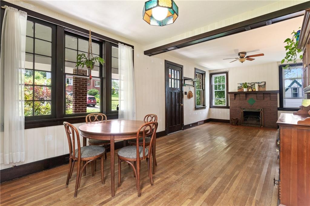 9 Woodside Road Pittsburgh, PA 15221 - Photo 6 of 24 a view of a dining room with furniture window and wooden floor