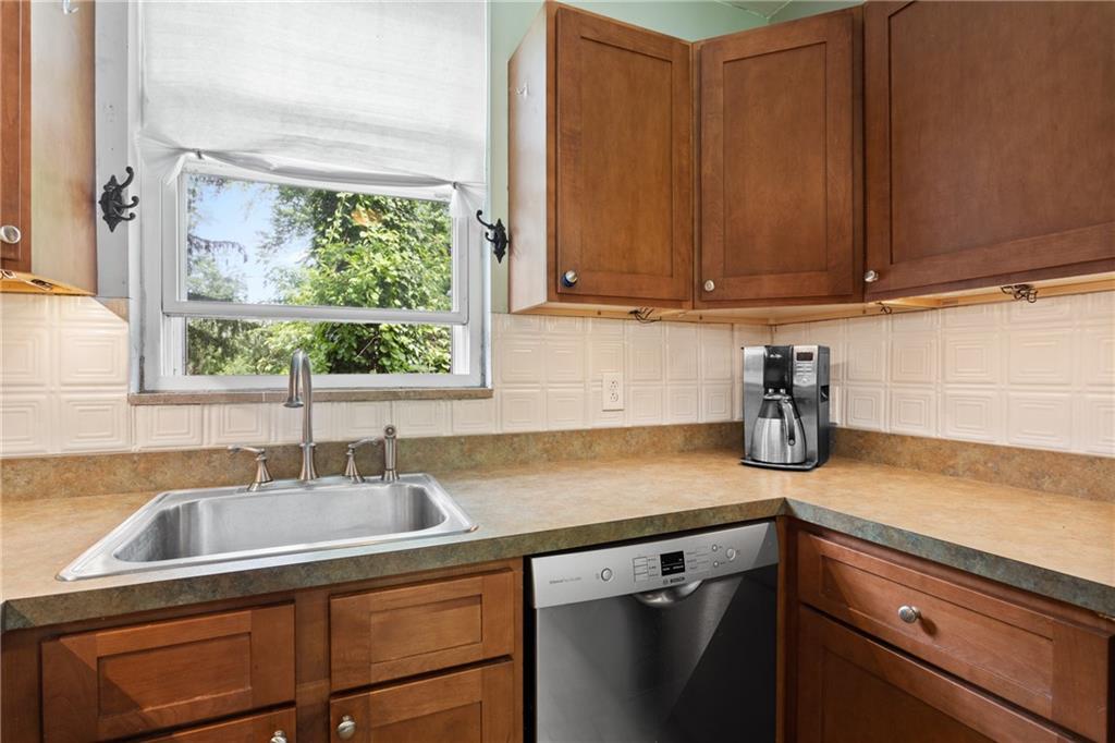 9 Woodside Road Pittsburgh, PA 15221 - Photo 9 of 24 a kitchen with a sink cabinets and a window