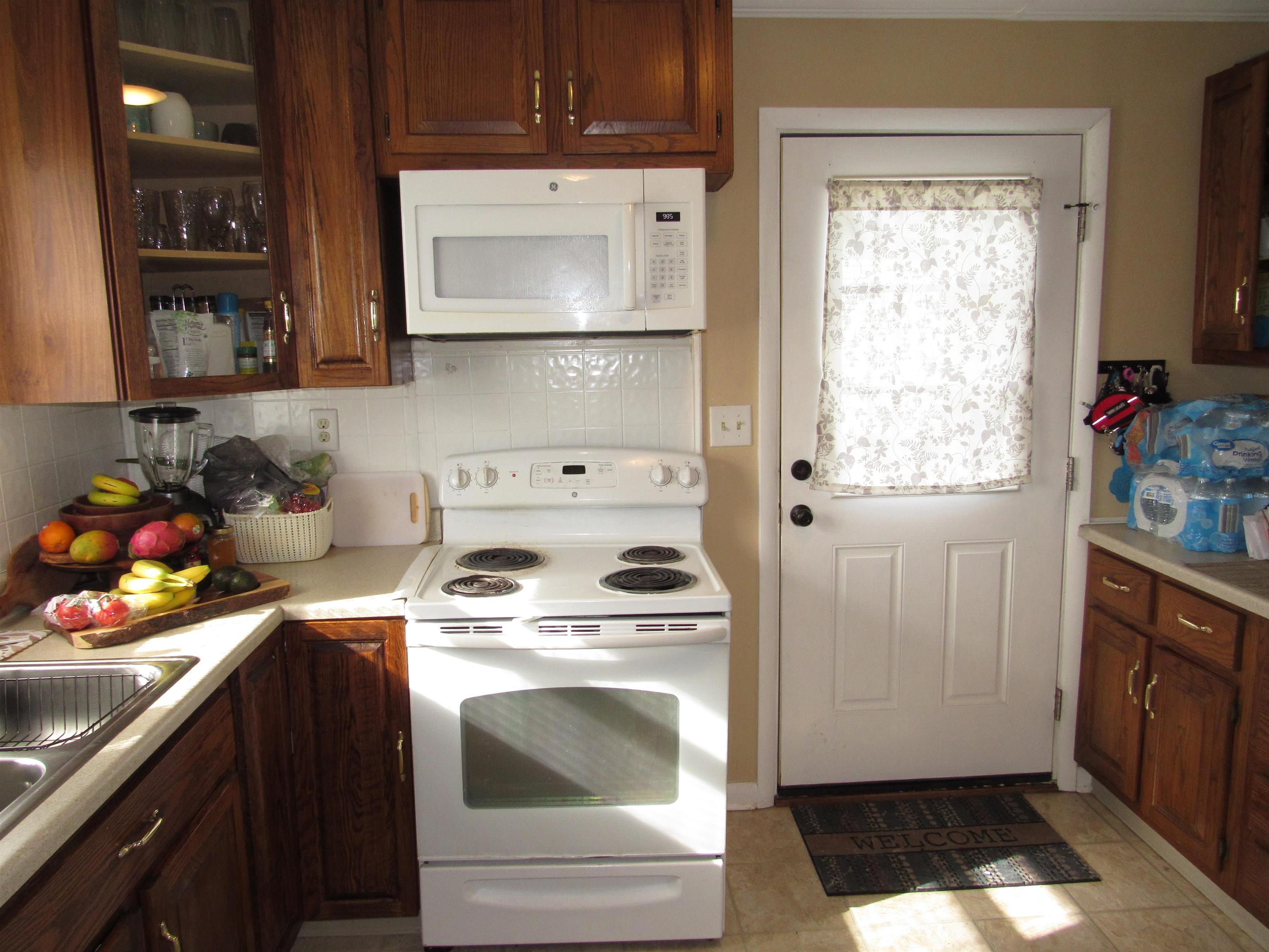 31 Stubblefield Road Waynesboro, VA 22980 - Photo 6 of 41 a kitchen with a stove top oven sink and cabinets