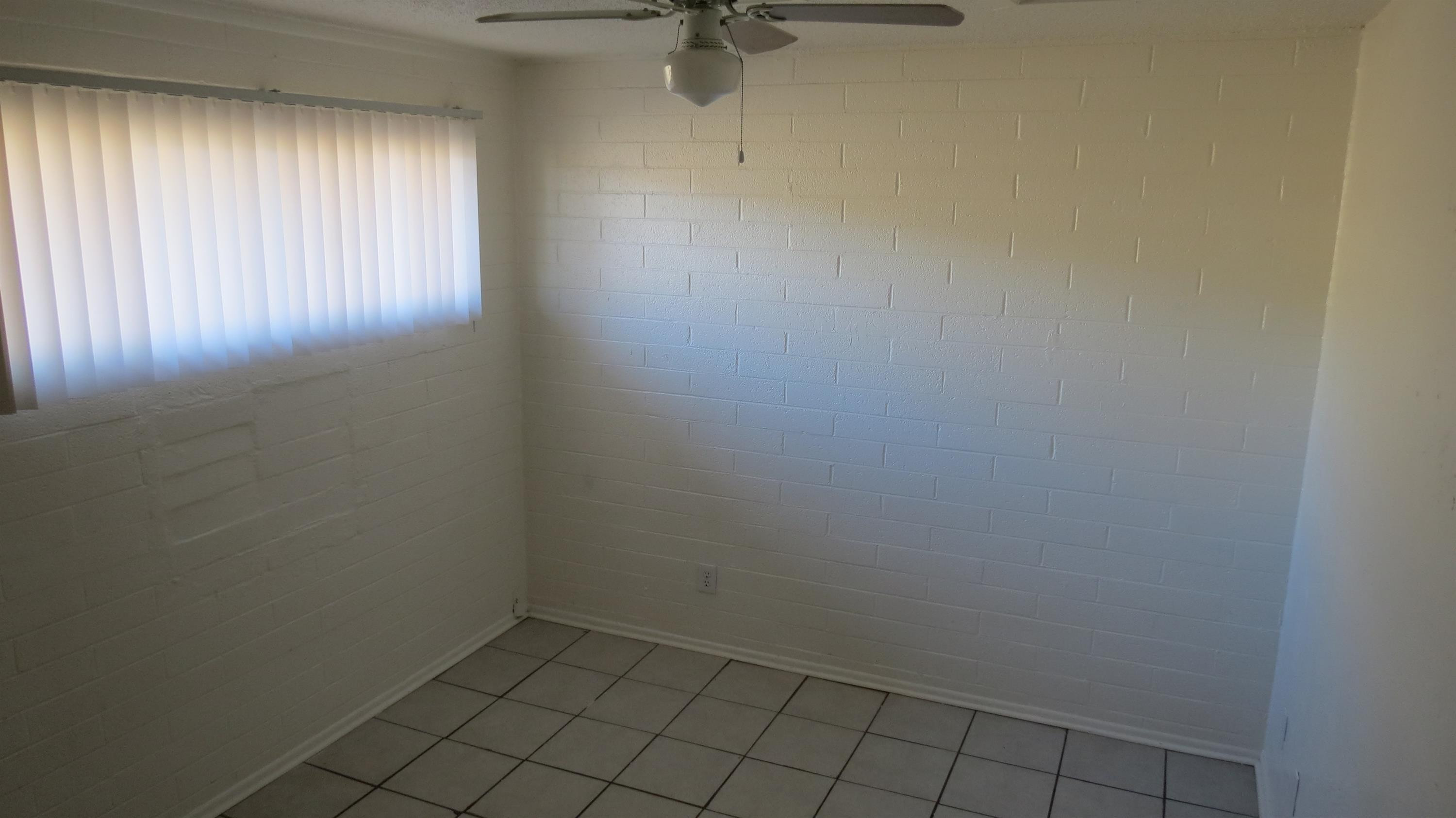4329 North Longview Avenue, Unit 2 Phoenix, AZ 85014 - Photo 8 of 12 an empty room with a window