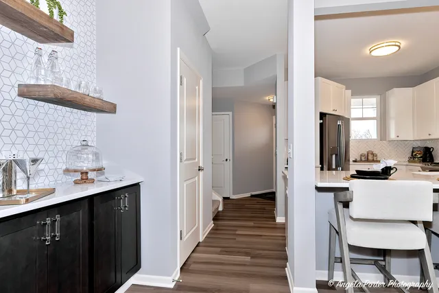 a kitchen with stainless steel appliances a sink stove and refrigerator