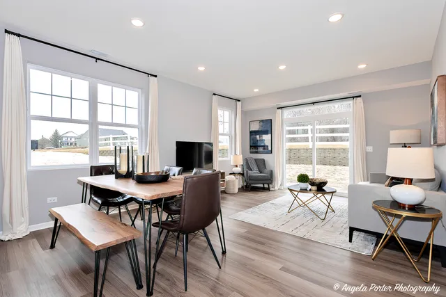 a view of a workspace with furniture window and wooden floor