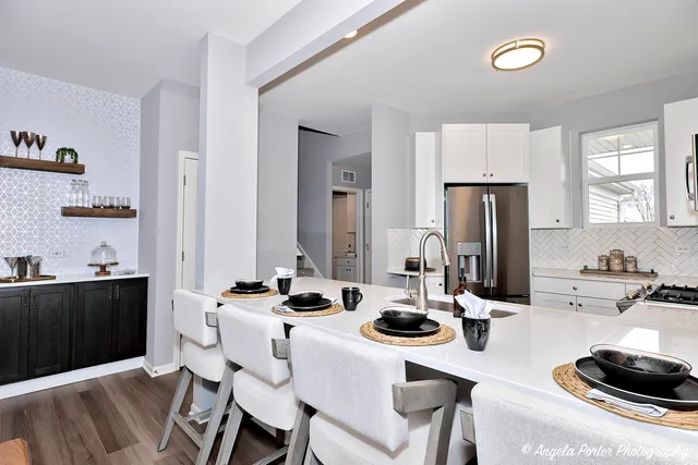 a kitchen with a table and chairs in it