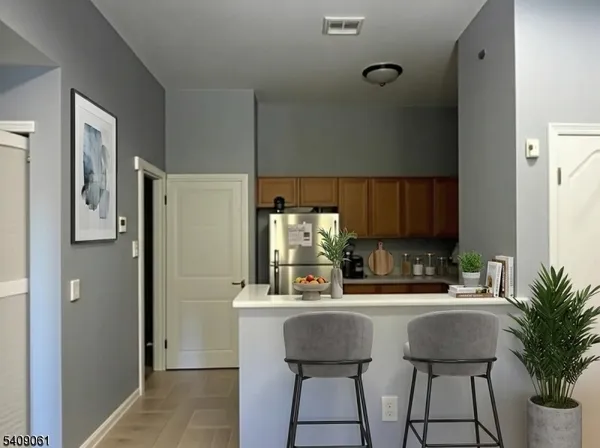 a kitchen with a sink cabinets and window