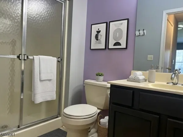 a bathroom with a toilet sink and shower