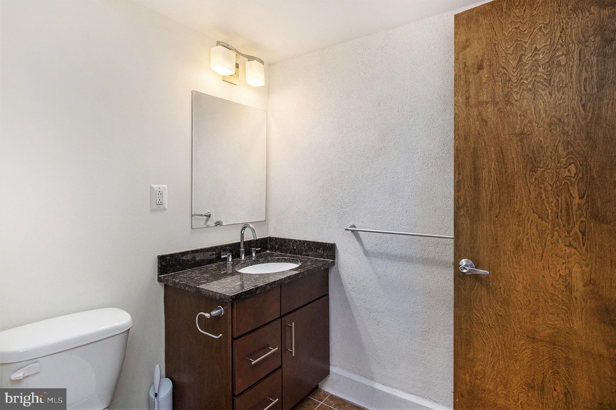 1201 Fitzwater Street, Unit 207 Philadelphia, PA 19147 - Photo 24 of 39 a bathroom with a sink and a toilet