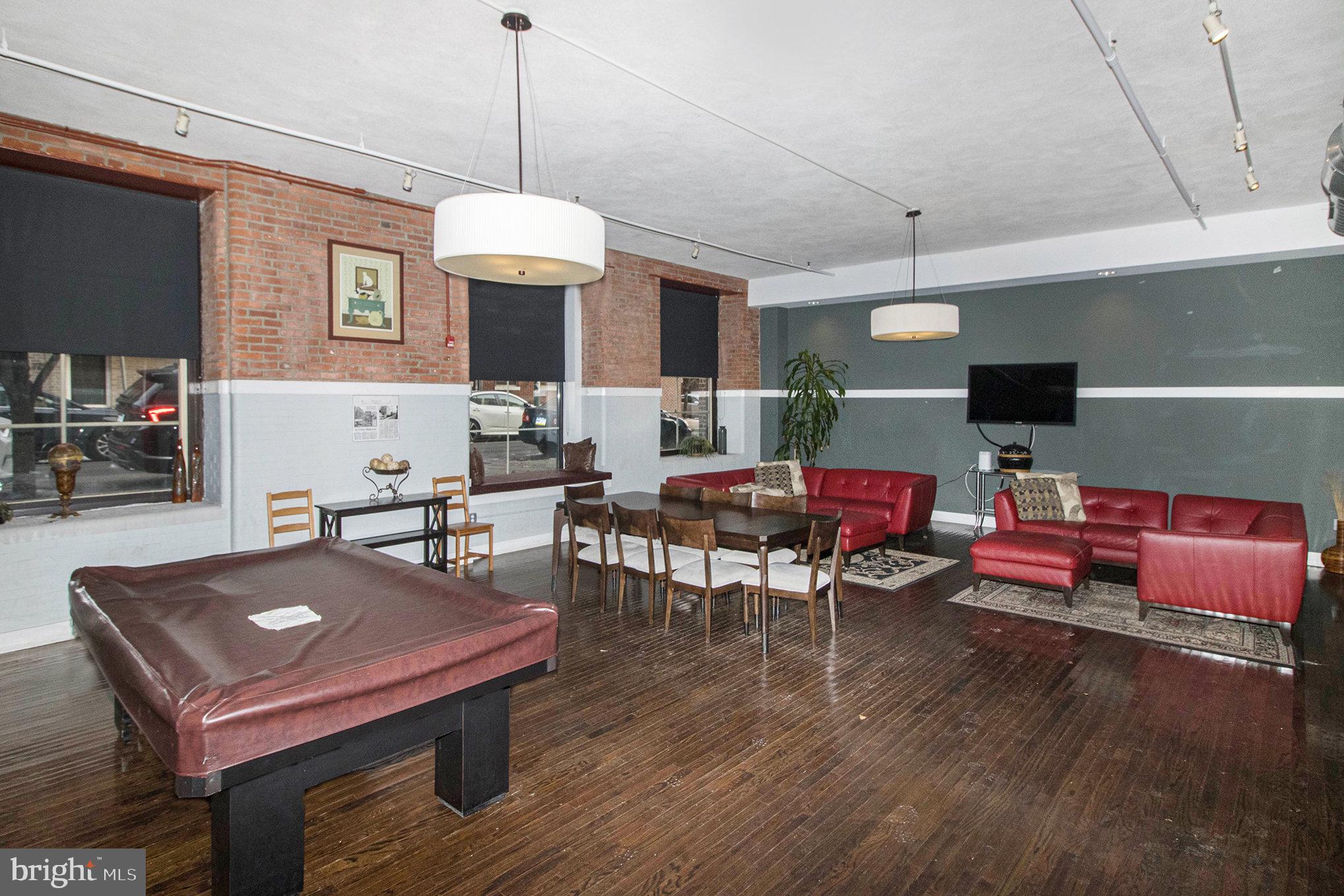 1201 Fitzwater Street, Unit 207 Philadelphia, PA 19147 - Photo 3 of 39 a view of a livingroom with furniture window and wooden floor