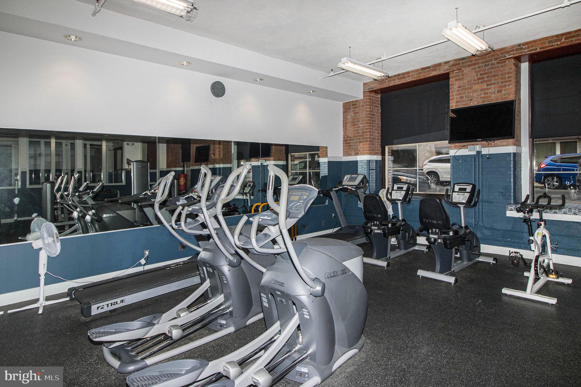 1201 Fitzwater Street, Unit 207 Philadelphia, PA 19147 - Photo 4 of 39 a view of a room with gym equipment