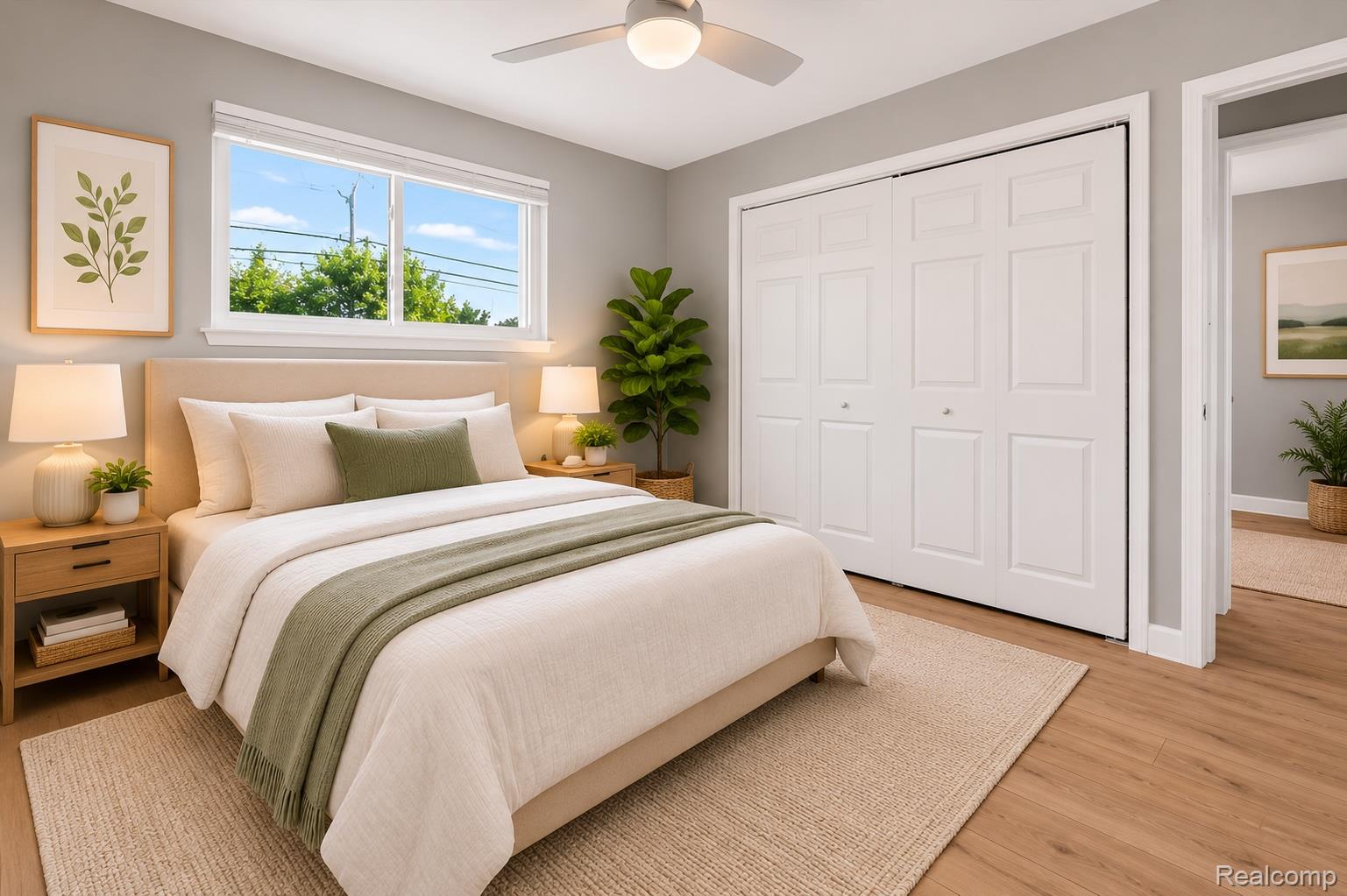 934 Harvard Road Berkley, MI 48072 - Photo 20 of 34 Bedroom featuring wood-finish flooring, a ceiling fan with integrated lighting, and a window with white trim