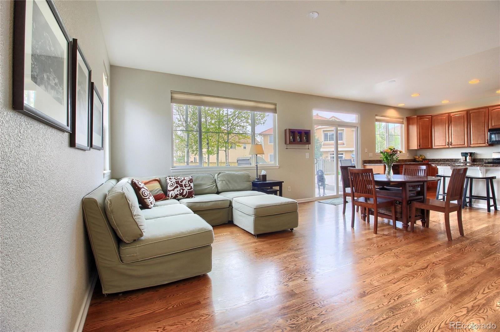 10677 Wynspire Road Highlands Ranch, CO 80130 - Photo 11 of 40 a living room with furniture and a large window