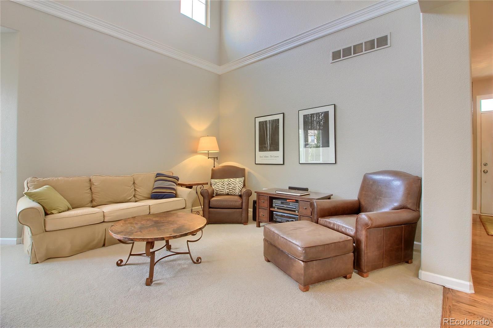 10677 Wynspire Road Highlands Ranch, CO 80130 - Photo 13 of 40 a living room with furniture