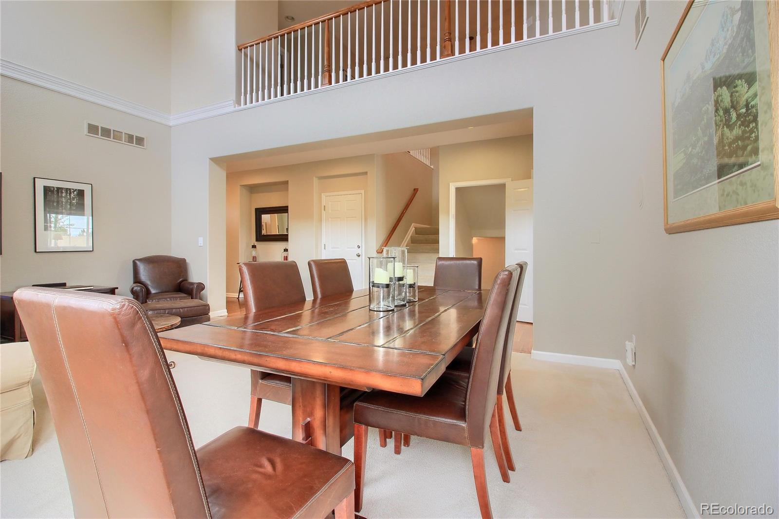 10677 Wynspire Road Highlands Ranch, CO 80130 - Photo 20 of 40 a view of a dining room with furniture