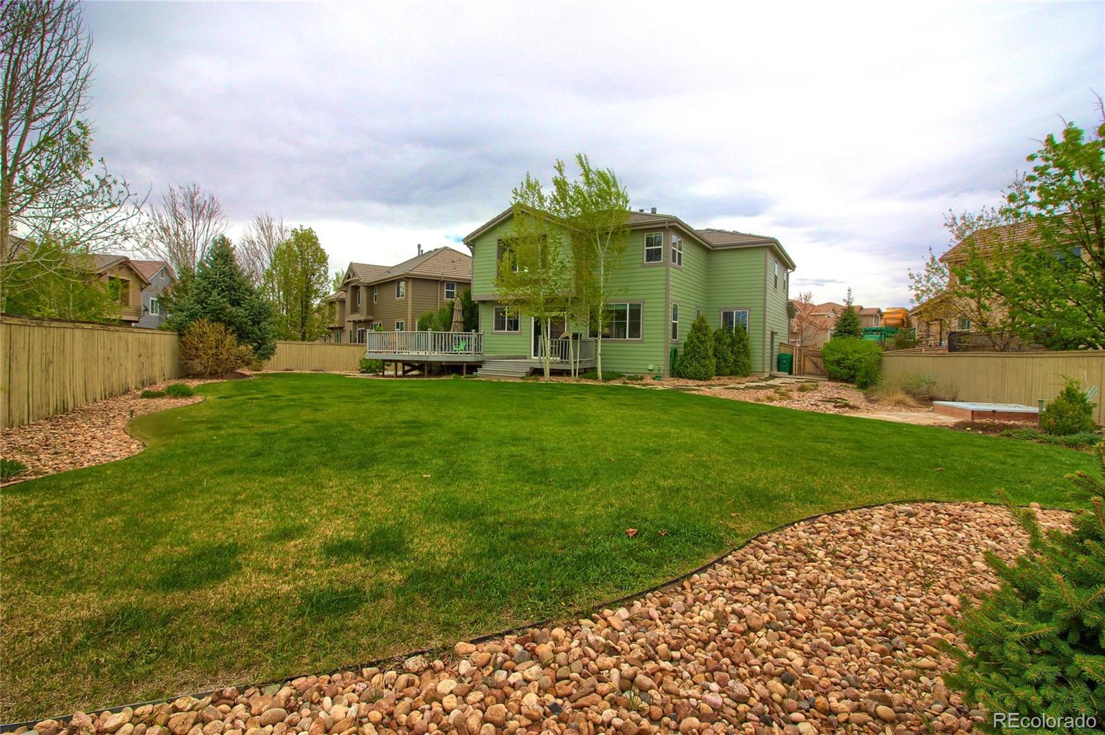 10677 Wynspire Road Highlands Ranch, CO 80130 - Photo 2 of 40 a view of a big yard of front a house