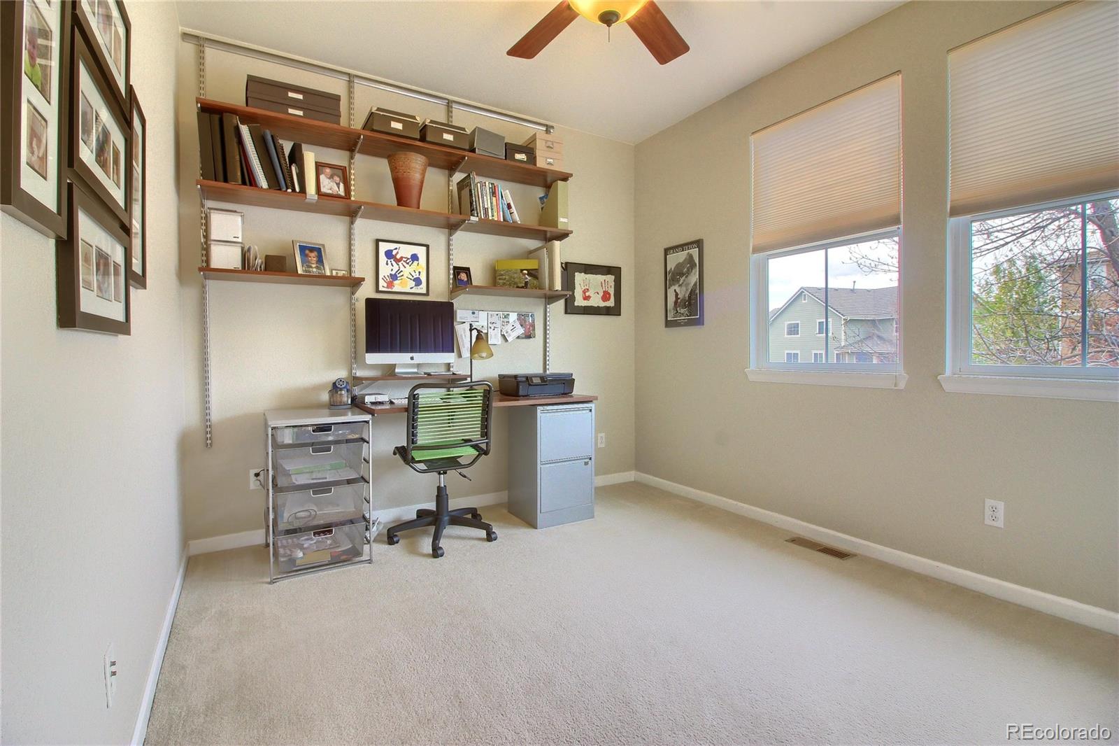 10677 Wynspire Road Highlands Ranch, CO 80130 - Photo 26 of 40 a view of a workspace with furniture and a window