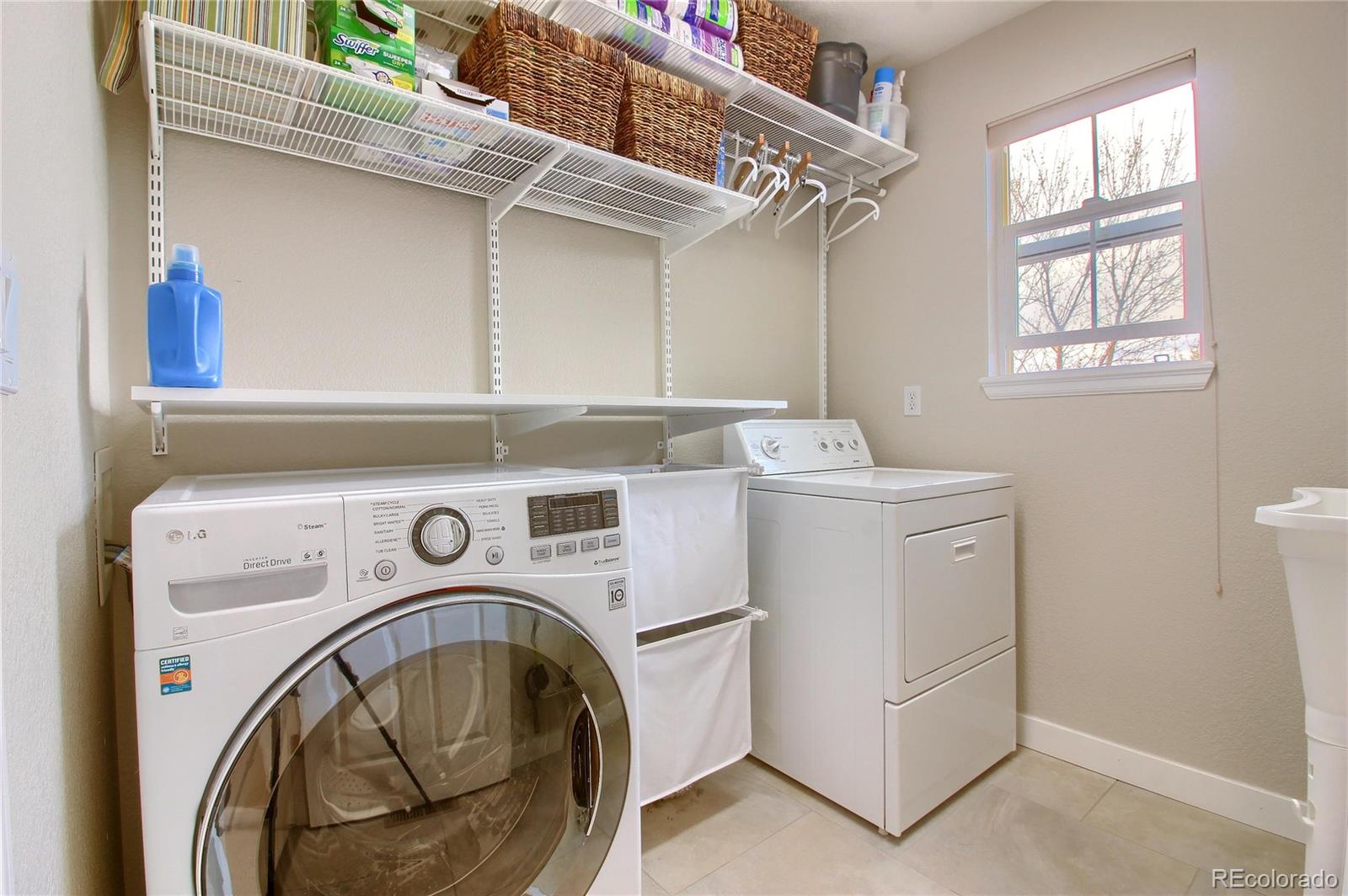 10677 Wynspire Road Highlands Ranch, CO 80130 - Photo 36 of 40 a utility room with dryer and washer