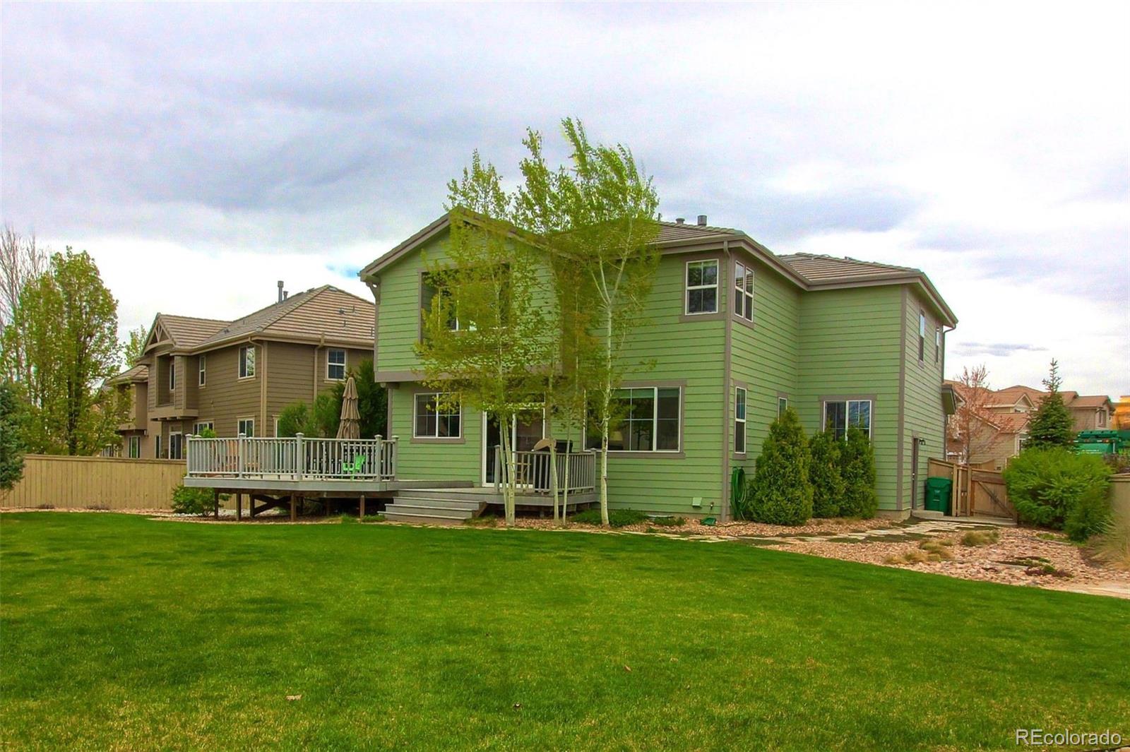 10677 Wynspire Road Highlands Ranch, CO 80130 - Photo 39 of 40 a front view of a house with a yard