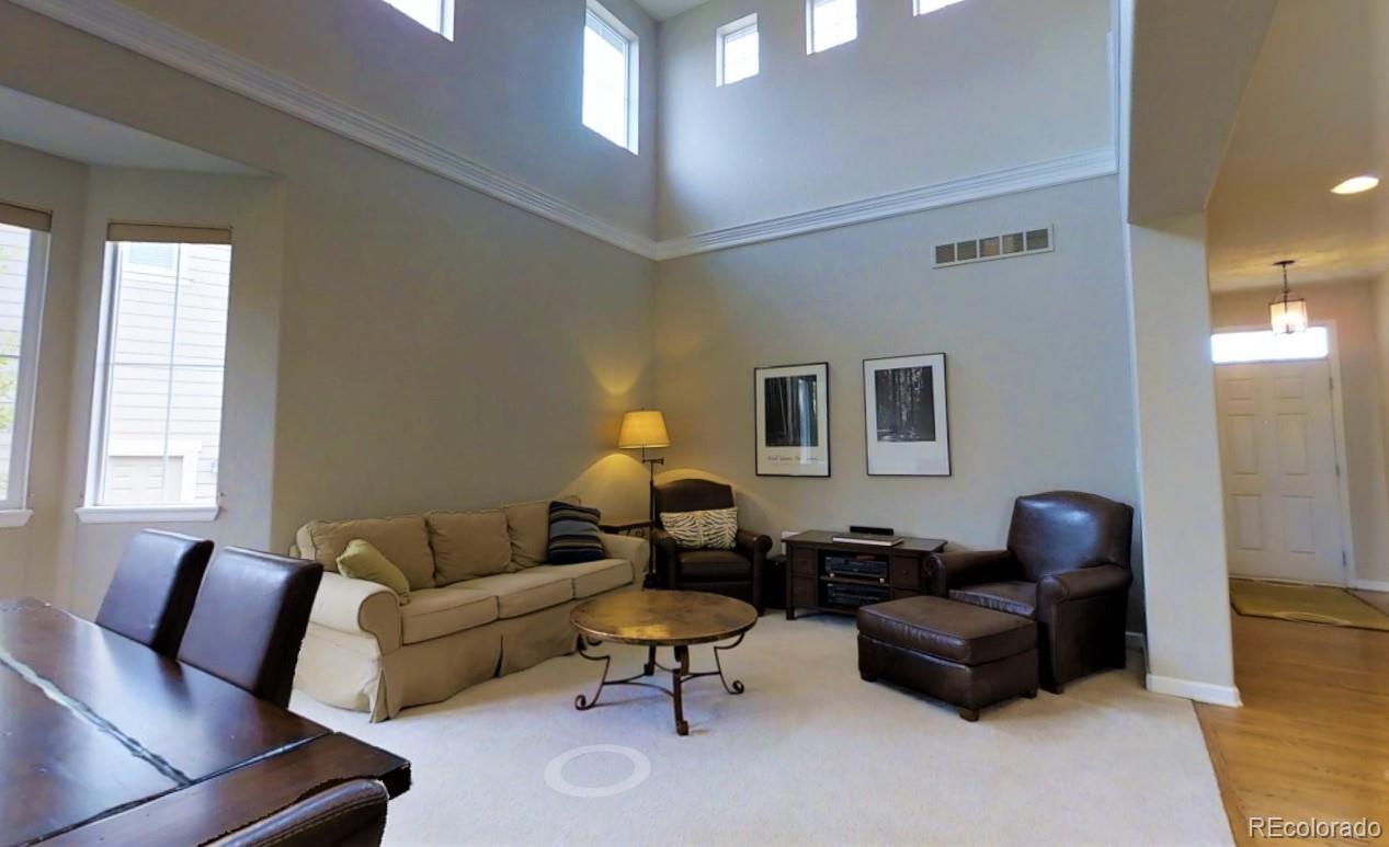 10677 Wynspire Road Highlands Ranch, CO 80130 - Photo 8 of 40 a living room with furniture
