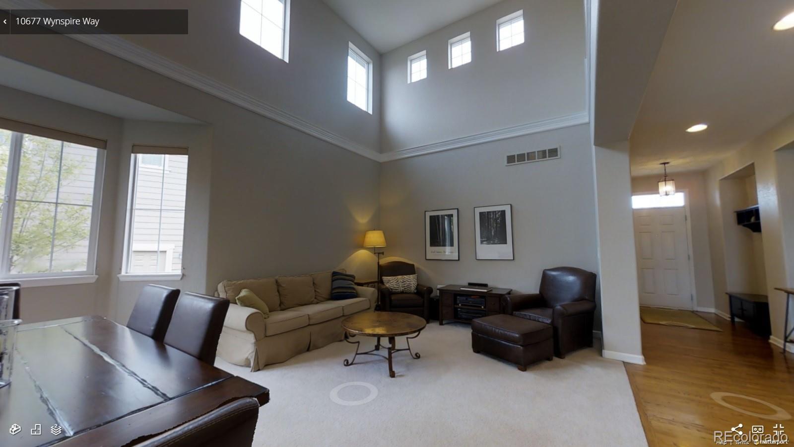 10677 Wynspire Road Highlands Ranch, CO 80130 - Photo 9 of 40 a living room with furniture and a window