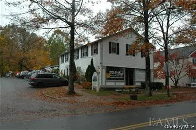a view of a car park in front of house
