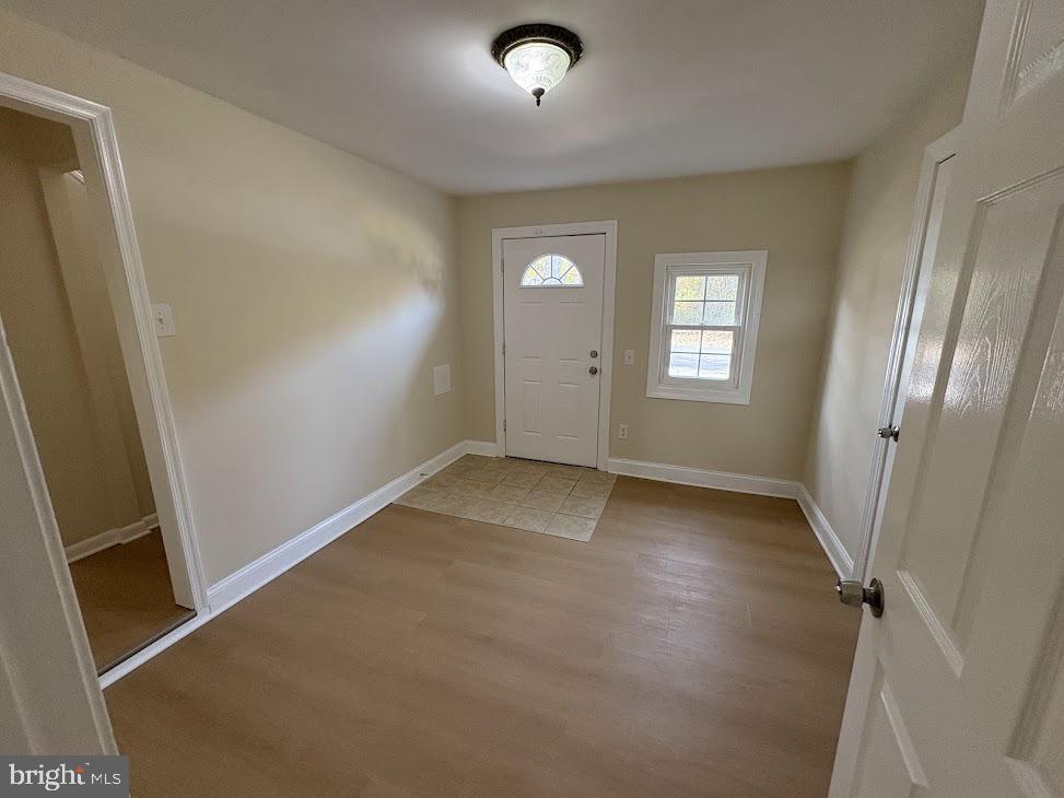 7907 Chalice Road Severn, MD 21144 - Photo 24 of 34 an empty room with windows