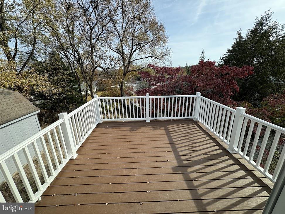 7907 Chalice Road Severn, MD 21144 - Photo 7 of 34 a view of balcony with wooden floor and fence