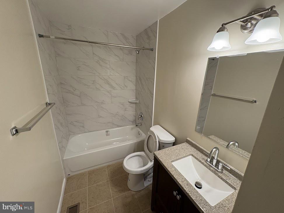 7907 Chalice Road Severn, MD 21144 - Photo 8 of 34 a bathroom with a sink toilet a mirror and shower