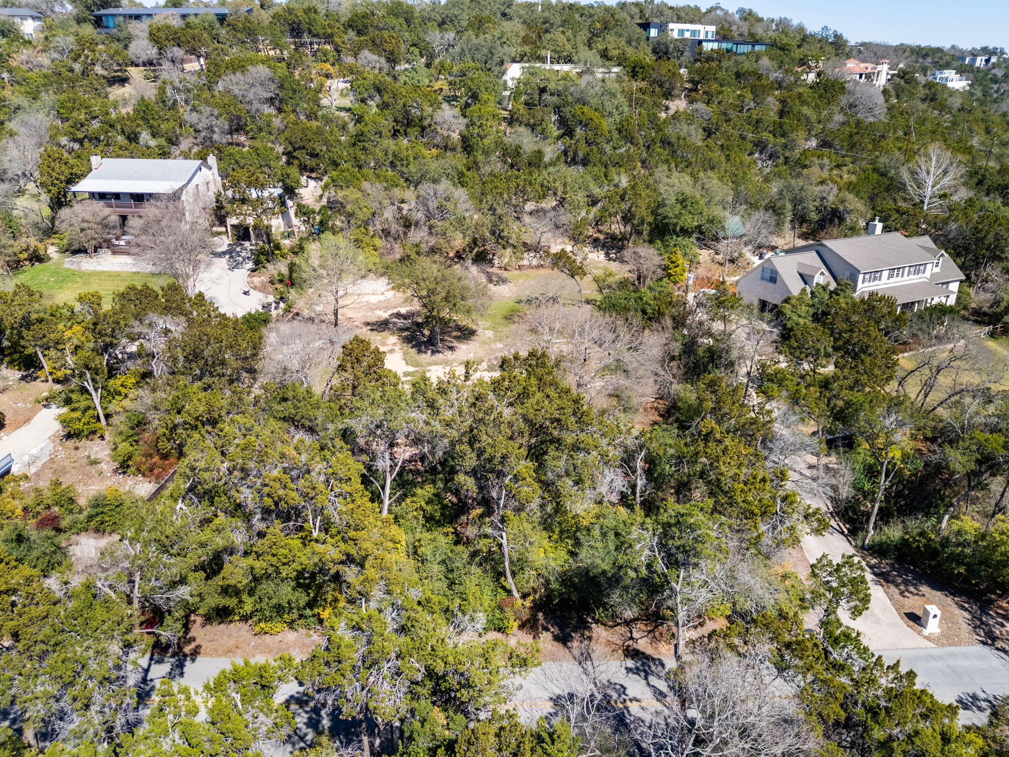 902 Yaupon Valley Road West Lake Hills, TX 78746 - Photo 9 of 25 an aerial view of residential house with parking space and trees around