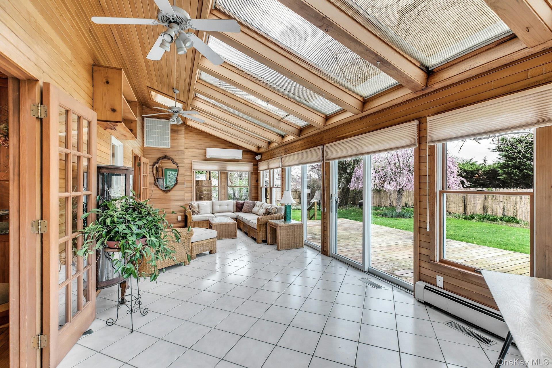 8 Adelphi Street Islip, NY 11751 - Photo 12 of 38 Sunroom Alternate View Picturing Sliders to Deck and Yard.