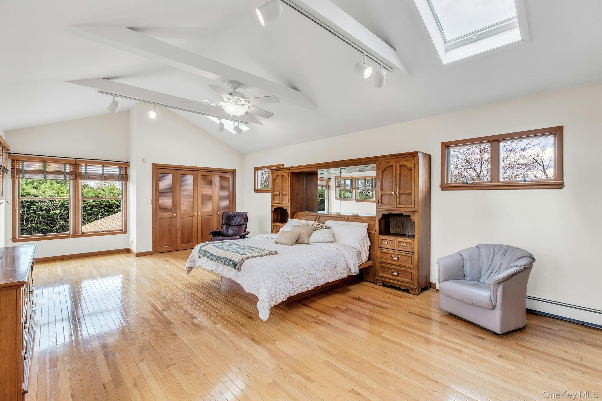 8 Adelphi Street Islip, NY 11751 - Photo 14 of 38 Primary Bedroom with 3 Walls of Windows, Cathedral Ceiling, Dual California Closets.