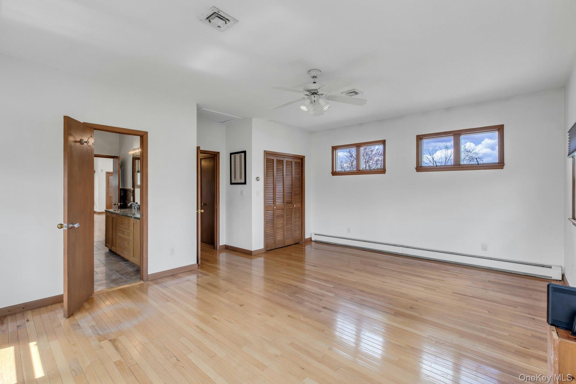 8 Adelphi Street Islip, NY 11751 - Photo 18 of 38 5th Bedroom/Sitting Room Picturing Hallway Entrance and En Suite Entrance to Primary Bathroom.