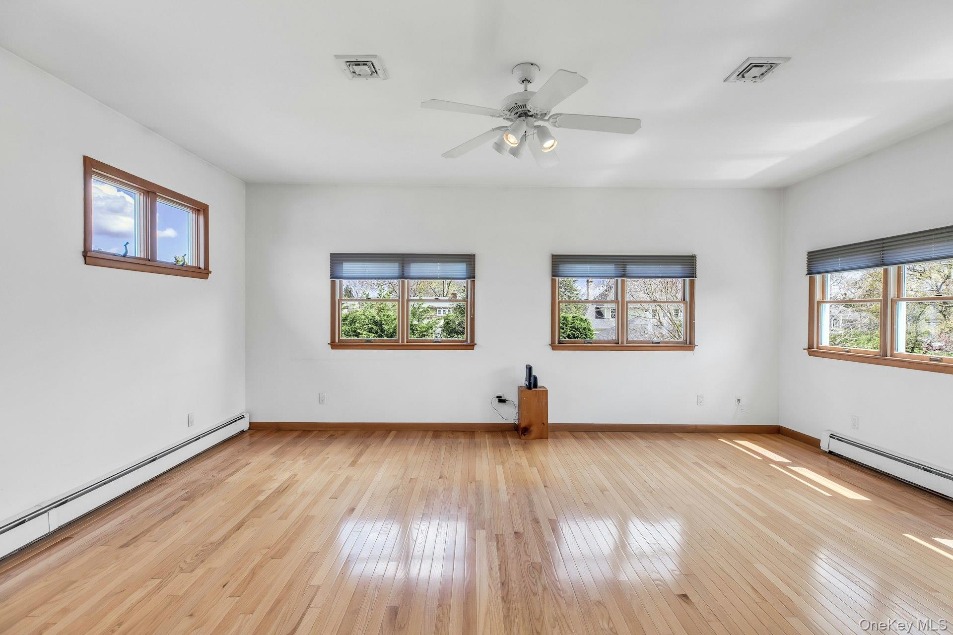 8 Adelphi Street Islip, NY 11751 - Photo 19 of 38 5th Bedroom/Sitting Room. Alternative View picturing 3 Walls of Windows.