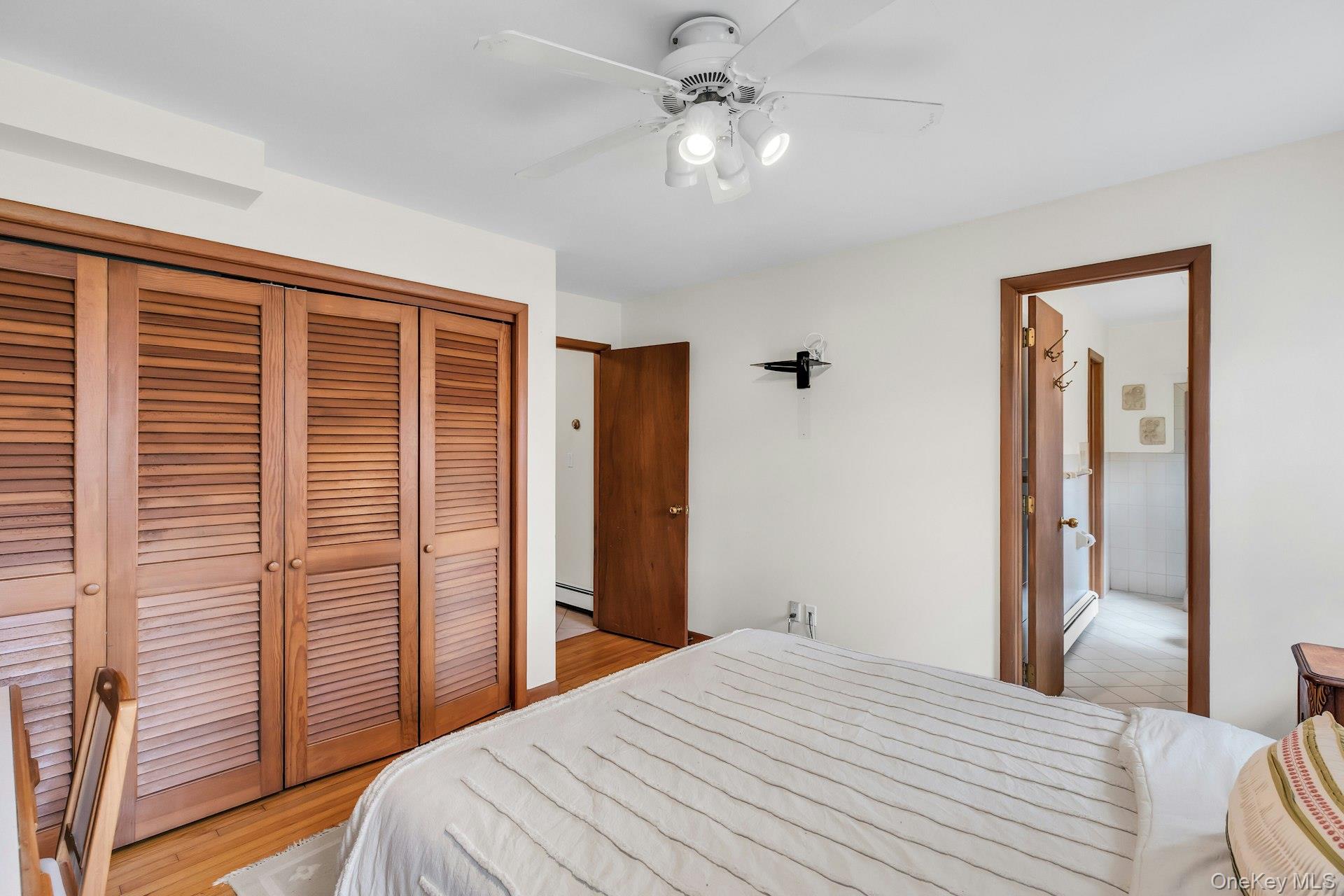 8 Adelphi Street Islip, NY 11751 - Photo 23 of 38 1st Level Bedroom 2. Alternate View Picturing Deep Double Closet and Entrance to Shared En Suite Bathroom with Bedroom 3.