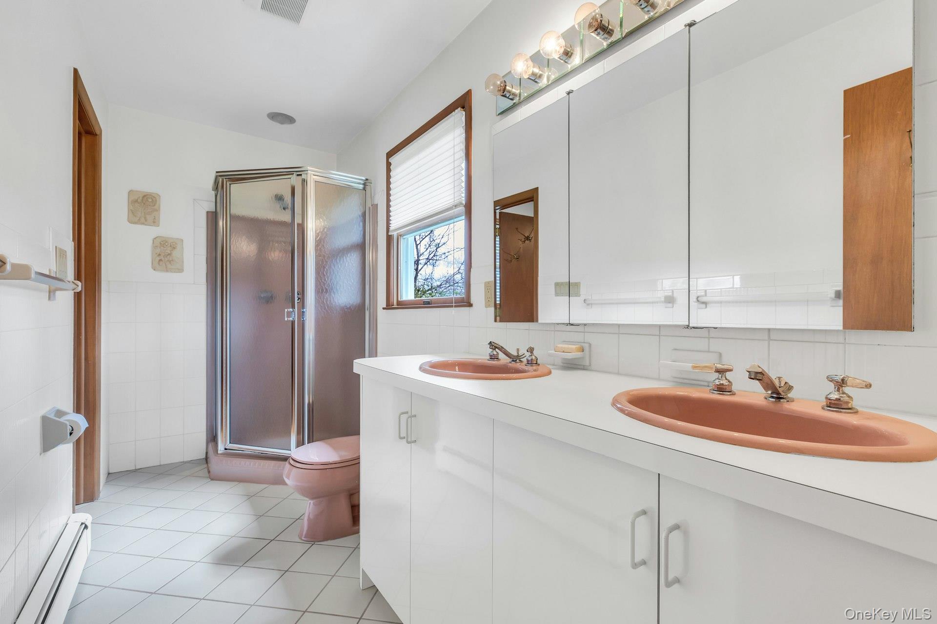 8 Adelphi Street Islip, NY 11751 - Photo 24 of 38 First Level Bathroom 2. Shared and En Suite to Bedroom 2 and Bedroom 3.