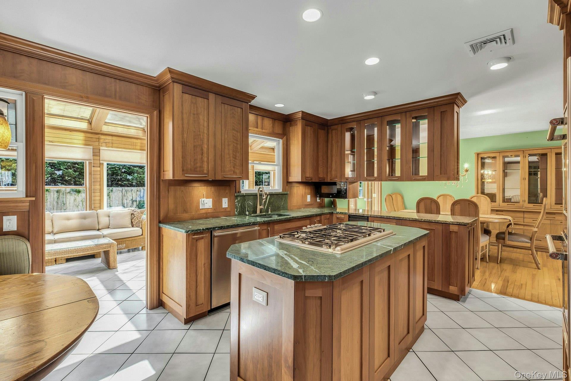 8 Adelphi Street Islip, NY 11751 - Photo 8 of 38 Kitchen Opens to Dining Room, Sunroom, and Entrance Foyer. Granite Counter Tops. Natural Cherry Cabinets.